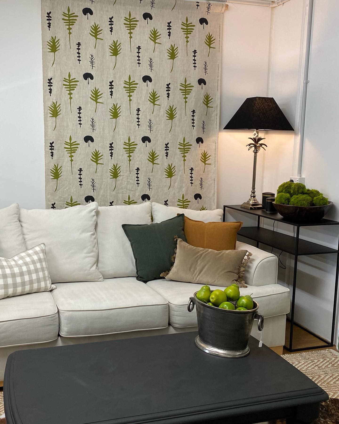 portrait designer cushions with various textures on a sofa